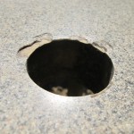 Some chipping around umbrella hole