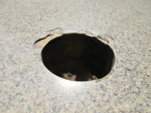 Some chipping around umbrella hole